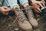Shoes, hands tie shoelace and hiking, person outdoor in nature for travel and adventure, explore and zoom. Boots, camping with start or prepare for walk, trekking and journey with health and fitness