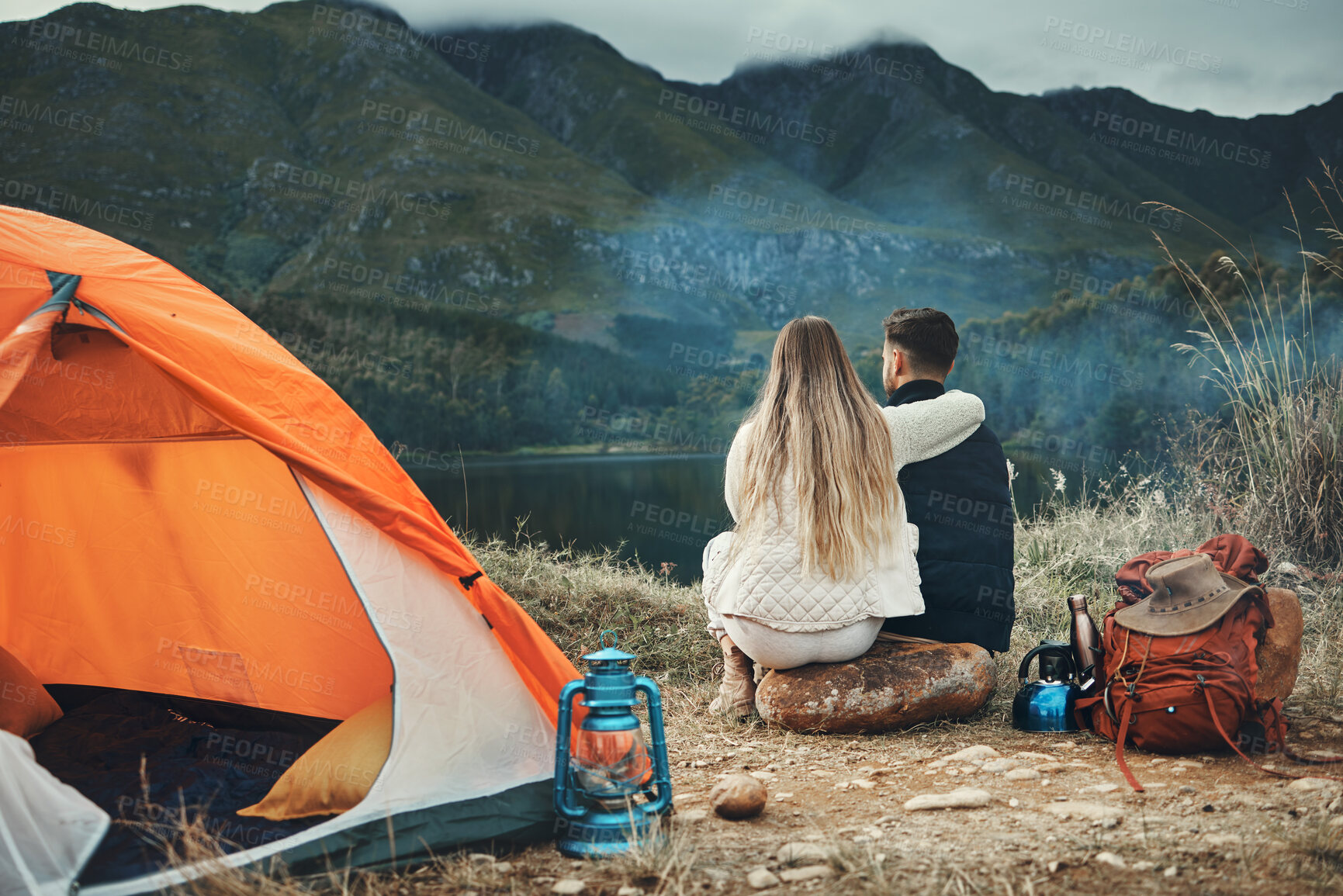 Buy stock photo Couple, hug and relax on mountain camping, adventure or travel in nature and environment. People, tent and bonding together with embrace, support or care and tent in forest and backpacking in woods