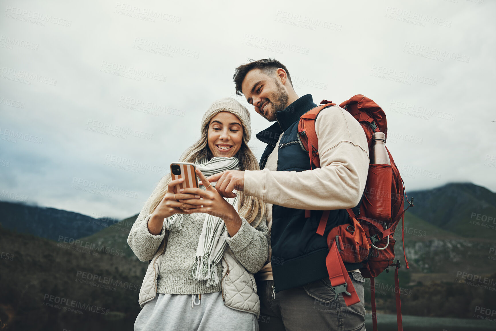 Buy stock photo Couple, phone and travel in nature or mountains with hiking information, social media or check for direction on journey. Happy people trekking in backpack, mobile chat or search for outdoor location 