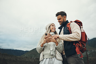 Buy stock photo Couple, phone and travel or hiking in nature with information, social media chat or map for outdoor journey. Happy people below in backpack and mountains trekking with mobile or search for location