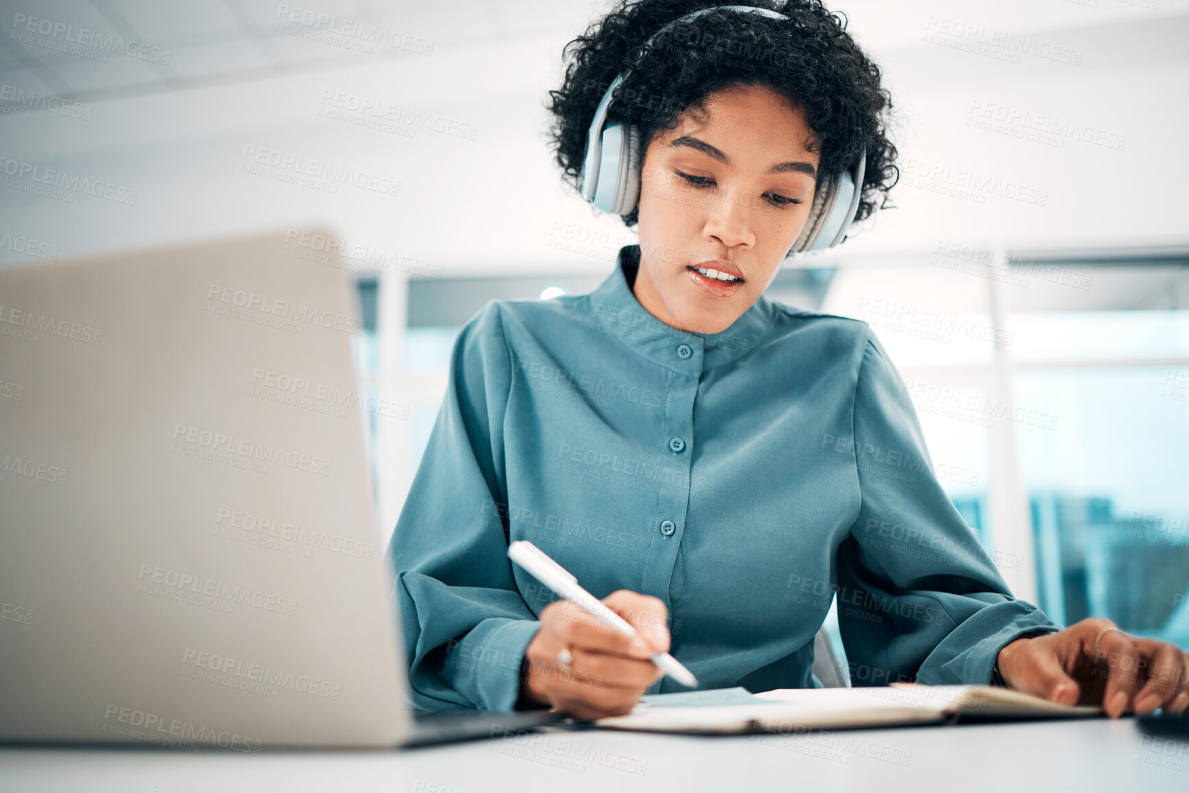 Buy stock photo Headphones, laptop and woman writing notes in the office doing research for creative project. Notebook, technology and professional female designer working, planning and listen to music in workplace.