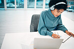 Headphones, computer and businesswoman writing notes in office doing research for creative project. Notebook, technology and professional female designer work, plan and listen to music in workplace