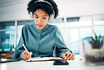 Headphones, notebook and businesswoman writing notes in the office doing research for creative project. Schedule, professional and female designer work, plan and listen to music in modern workplace.