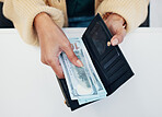 Woman, hands and wallet with money for savings, investment or payment on counter at checkout. Top view or closeup of female person with cash, bills or paper notes for finance, purchase or shopping
