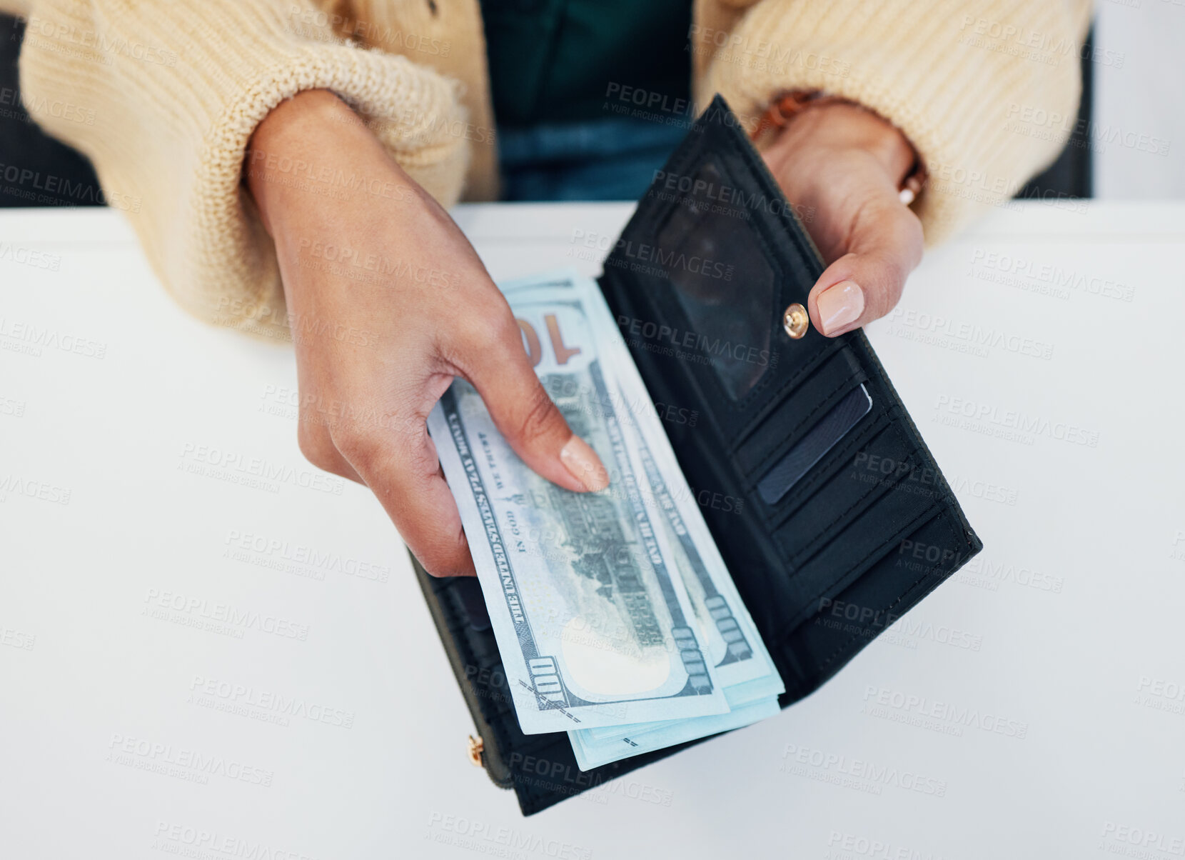Buy stock photo Woman, hands and wallet with money for savings, investment or payment on counter at checkout. Top view or closeup of female person with cash, bills or paper notes for finance, purchase or shopping