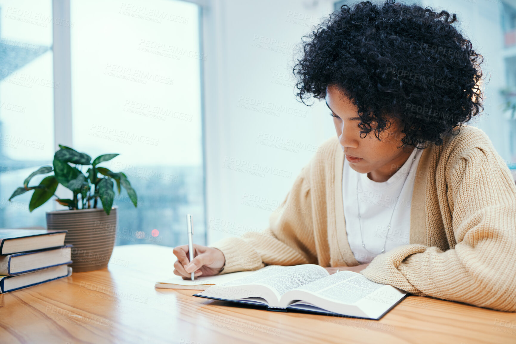 Buy stock photo Bible, notes and woman studying religion at desk in home, Christian faith and knowledge of God for hope. Reading, writing and girl at table with holy book, learning gospel for inspiration and prayer.