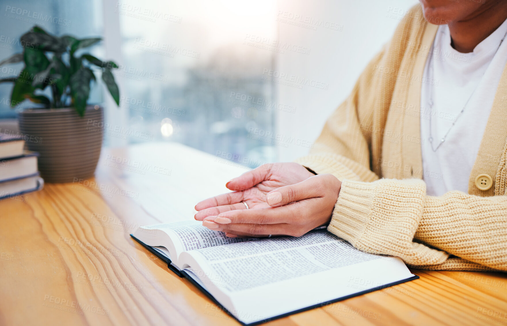 Buy stock photo Bible, worship and open hands of woman in prayer, studying religion in home with Christian faith and knowledge of God. Reading, gospel and girl at table with holy book for spiritual praise and giving