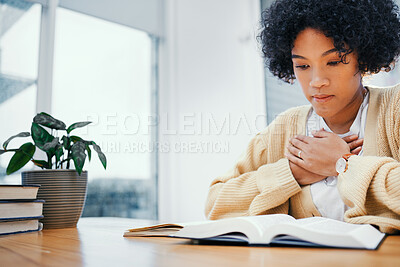 Buy stock photo Bible, prayer and woman studying religion at desk in home, Christian faith and knowledge of God for hope. Reading, praise and girl at table with holy book, learning gospel for inspiration or theology