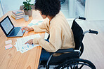 Office, documents and woman in wheelchair on laptop working on project, data report and research at desk. Company, startup and person with disability on computer for internet, analysis and graphs