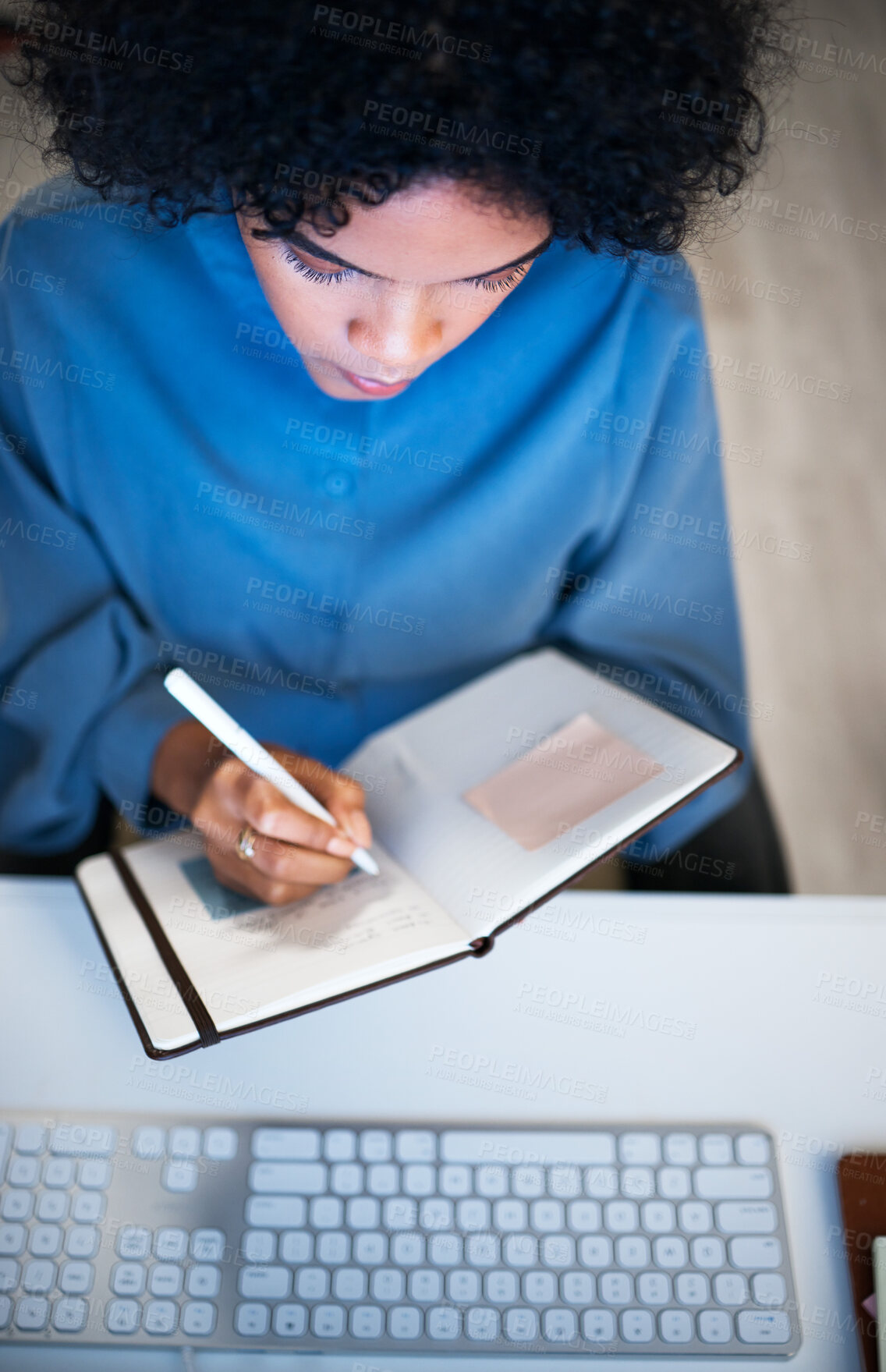 Buy stock photo Woman with notebook, writing and checking schedule, agenda and reminder for office administration. Calendar, diary or journal, girl at desk planning notes for time management productivity from above.