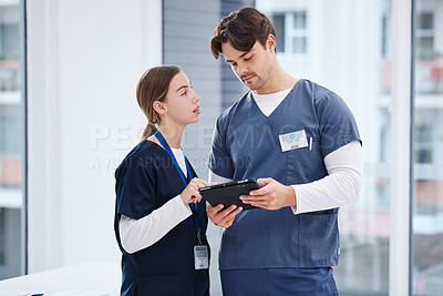 Buy stock photo Doctors, man and woman with tablet at hospital with discussion, healthcare and teamwork. Medical professional, nurse and surgeon with digital app for telehealth, insurance website and clinic advice