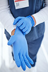 Gloves, hospital and hands of doctor for medicine, surgery and working in clinic for wellness. Healthcare, help and person with ppe for safety, protection and hygiene in medical service or procedure