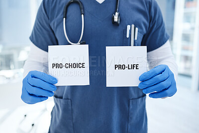 Buy stock photo Closeup, doctor and abortion with option, card and healthcare in a hospital, policy and law. Zoom, person and medical professional with poster, choice and paper with nurse and decision in a clinic