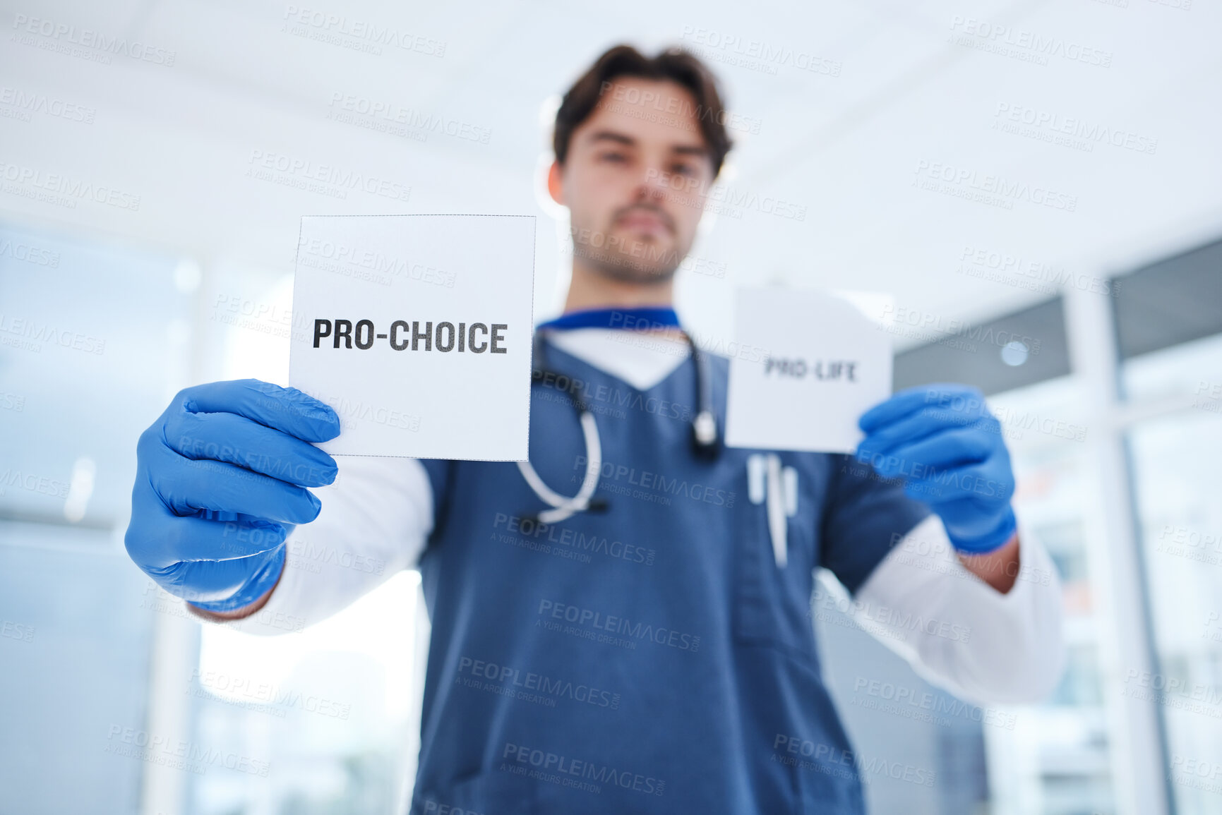 Buy stock photo Abortion, choice and doctor with paper in clinic for human rights to pregnancy, healthcare and control of body. Nurse, decision and poster with support or vote for contraception, care and medicine