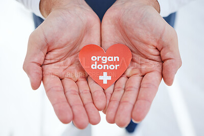 Buy stock photo Doctor, hands and transplant for organ donor, support and good deed for healthcare, medical service and work. Nurse, hospital and charity for help, heart and sign for medicare, compassion or donation
