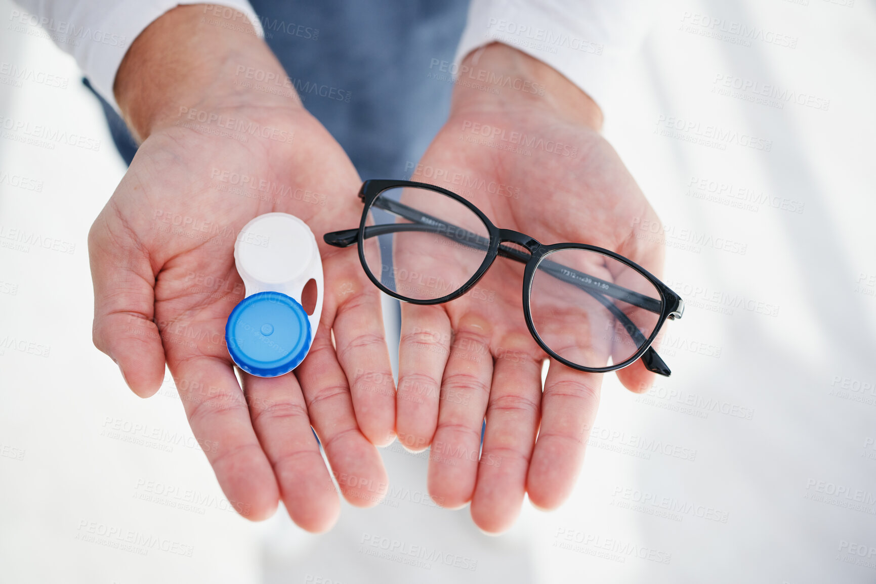 Buy stock photo Eye care, hands of doctor with glasses and contact lens in case for vision, help with eyesight and choice. Eyecare, decision and sight, man giving lenses in container and frame for eyewear option.