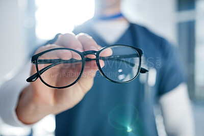 Buy stock photo Optometry, glasses and hands of optician with frames, prescription lens and spectacles for sight. Healthcare, ophthalmology and person in clinic for eye care, vision and medical service for wellness