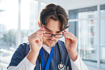 Optometry, glasses and man in clinic with frame, prescription lens and spectacles for eyesight. Healthcare, ophthalmology and face of optician for eye care, vision and medical service for wellness