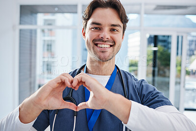 Buy stock photo Heart in hands, hospital and portrait of doctor for support, charity and working in clinic for wellness. Healthcare, emoji and happy man with gesture for medical service, consulting and insurance