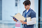 Hospital folder, doctor and man reading documents, healthcare records or clinic information. Wellness services, medical research and professional nurse, surgeon or expert check paperwork portfolio