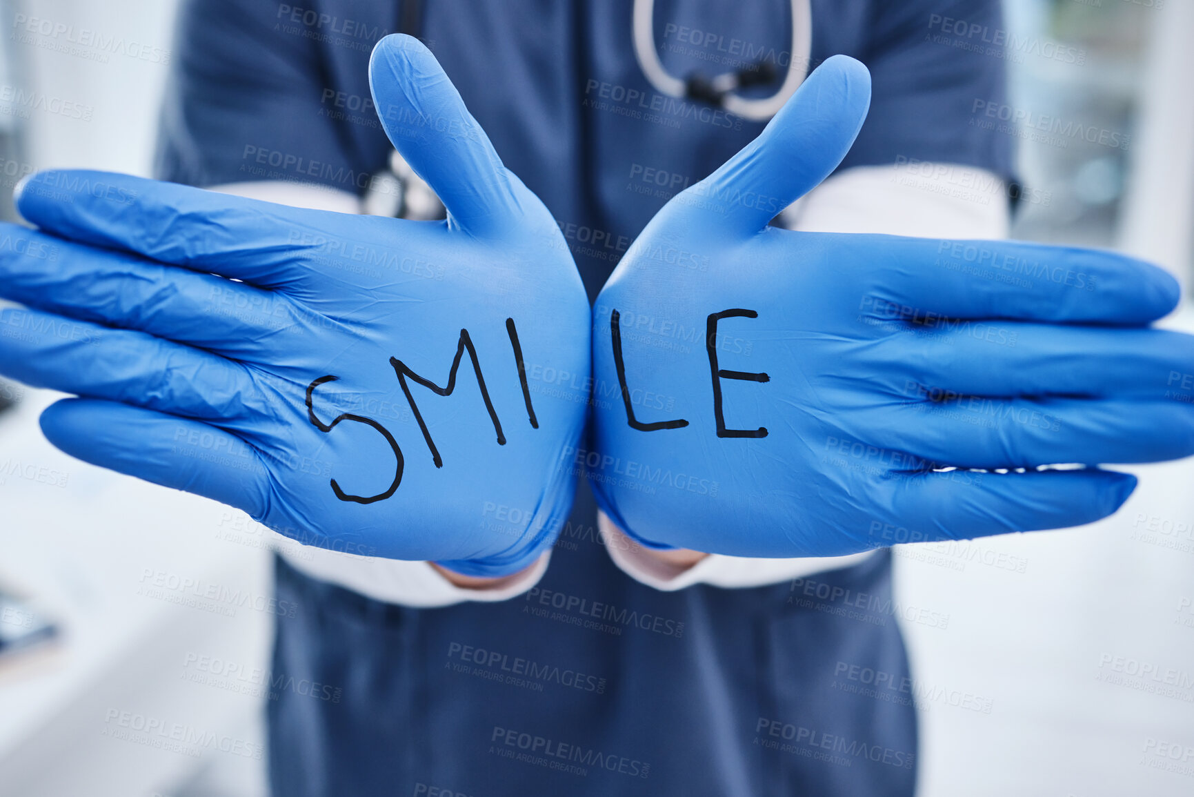 Buy stock photo Healthcare, message and hands of a doctor with gloves for a smile, medical safety and information. Showing, surgery and a nurse or surgeon with words for motivation, health and support at a clinic