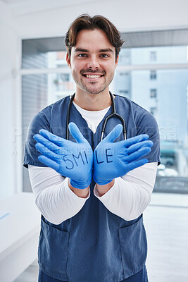 Buy stock photo Doctor, portrait and gloves with smile in hospital, medicine and communication for healthcare in hands. Man, nurse and face in welcome gesture to surgery, patient help and consulting clinic in trust