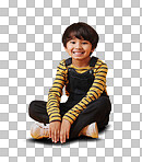 A cute little asian boy sitting on the floor with casual clothes while laughing and crossing his legs against an orange copyspace  background. Adorable happy little boy safe and alone