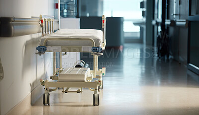 Buy stock photo Healthcare, medicine and a bed in the hallway of a hospital after work, ready for an emergency or accident. Medical, wellness and service with a gurney in the empty corridor of a health clinic