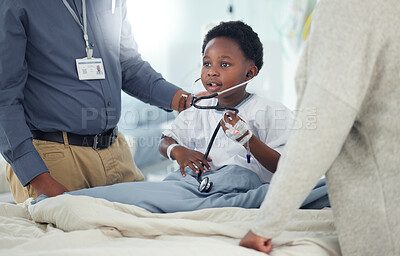 Buy stock photo Pediatrician, mother or child with stethoscope to play in hospital for medical exam, game or lungs test. Doctor, monitor or young African boy listening to heart beat with parent or mom for wellness