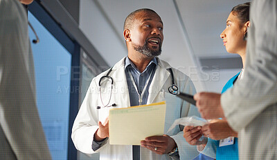 Buy stock photo Black man, nurses or doctors talking in meeting for advice in healthcare discussion for documents. Mature surgeon, leadership or team working in collaboration for medical research in hospital clinic 