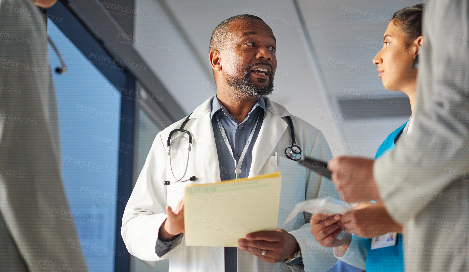 Buy stock photo Black man, nurses or doctors talking in meeting for advice in healthcare discussion for documents. Mature surgeon, leadership or team working in collaboration for medical research in hospital clinic 