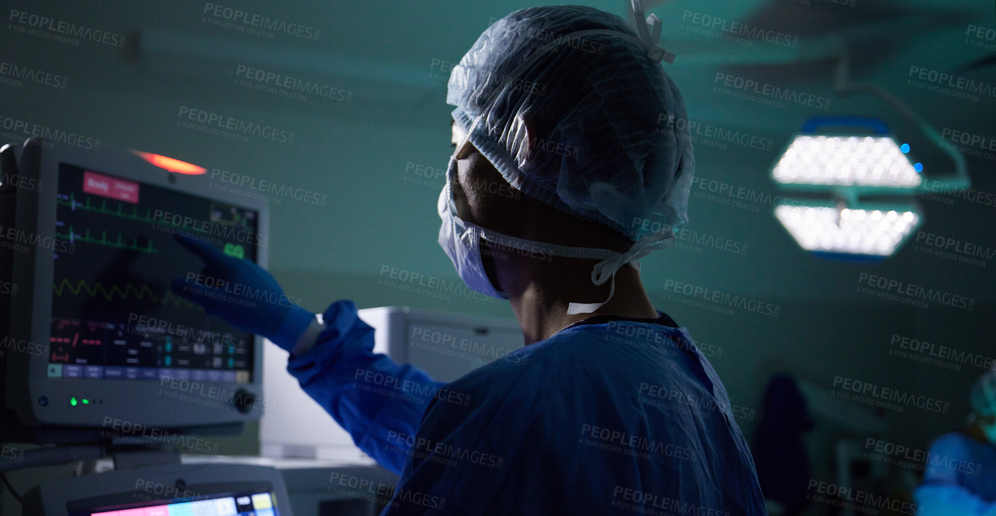 Buy stock photo Back, medical and monitor with a doctor in theater for surgery or a healthcare procedure at the hospital. Medicine, technology and equipment with a professional surgeon in a clinic for an operation