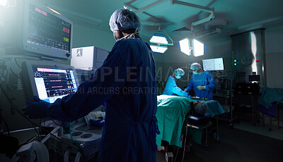 Buy stock photo Back, medicine and monitor with a doctor in theater for surgery or a healthcare procedure at the hospital. Medical, technology and equipment with a professional surgeon in a clinic for an operation