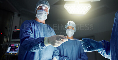 Buy stock photo Doctors, team and equipment in surgery, healthcare and treatment for injury, support and trust. Surgeons, collaboration and hands over tool, teamwork and operation in theatre, medicare and hospital