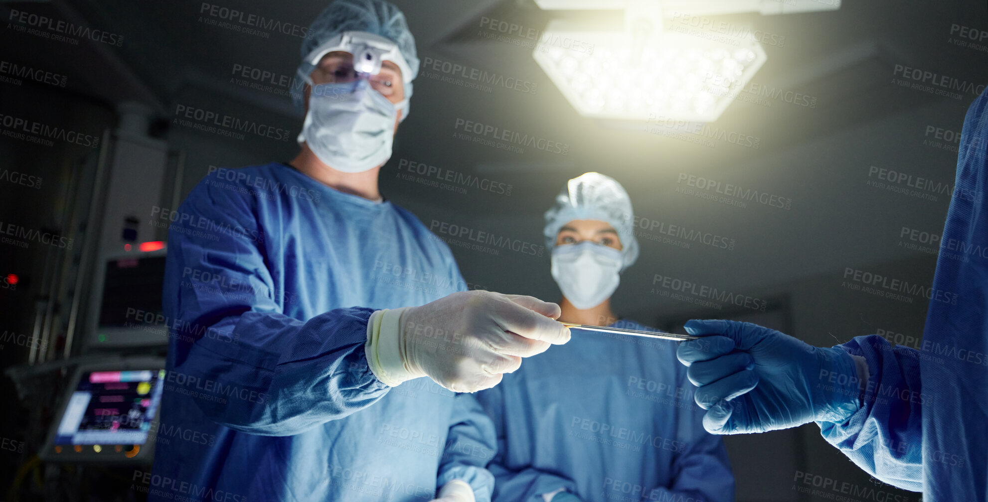 Buy stock photo Doctors, team and equipment in surgery, healthcare and treatment for injury, support and trust. Surgeons, collaboration and hands over tool, teamwork and operation in theatre, medicare and hospital