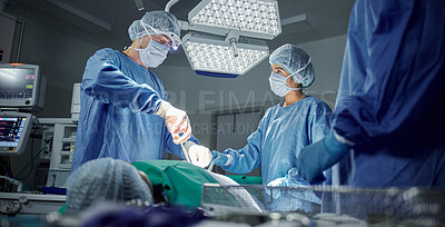 Buy stock photo Teamwork, medical and doctors working on a surgery for healthcare treatment in a theatre room. Collaboration, career and professional surgeons doing an operation on a patient in a hospital or clinic.