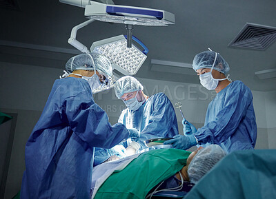 Buy stock photo Collaboration, healthcare and doctors working on a surgery for medical treatment in a theatre room. Teamwork, career and professional surgeons doing an operation on a patient in a hospital or clinic.