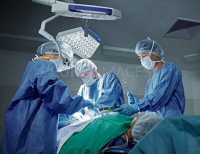 Buy stock photo Teamwork, healthcare and doctors working on a surgery for medical treatment in a theatre room. Collaboration, career and professional surgeons doing an operation on a patient in a hospital or clinic.