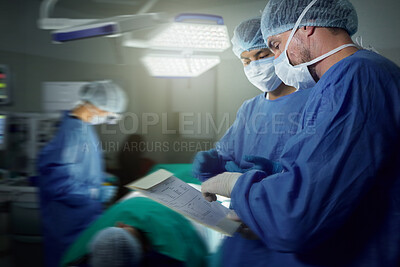 Buy stock photo Healthcare, surgeon and a team in a hospital for surgery together, working in theater to save a life. Medical teamwork, emergency and doctors in the operating room of a clinic for an operation