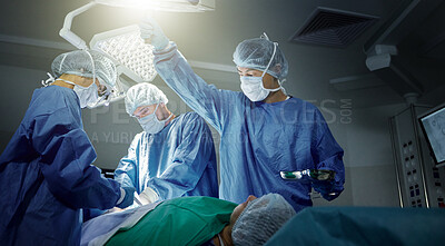 Buy stock photo Teamwork, healthcare and surgeons working on a surgery for medical treatment in a theatre room. Collaboration, career and professional doctors doing an operation on a patient in a hospital or clinic.