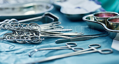 Buy stock photo Background, surgery and metal tools in operating room for hospital assessment, healthcare service or emergency in medical theatre. Closeup, surgical equipment and scissors with forceps for operation