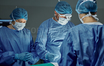 Buy stock photo Teamwork, healthcare and doctors working on an operation for medical treatment in a theatre room. Collaboration, career and professional surgeons doing a surgery on a patient in a hospital or clinic.
