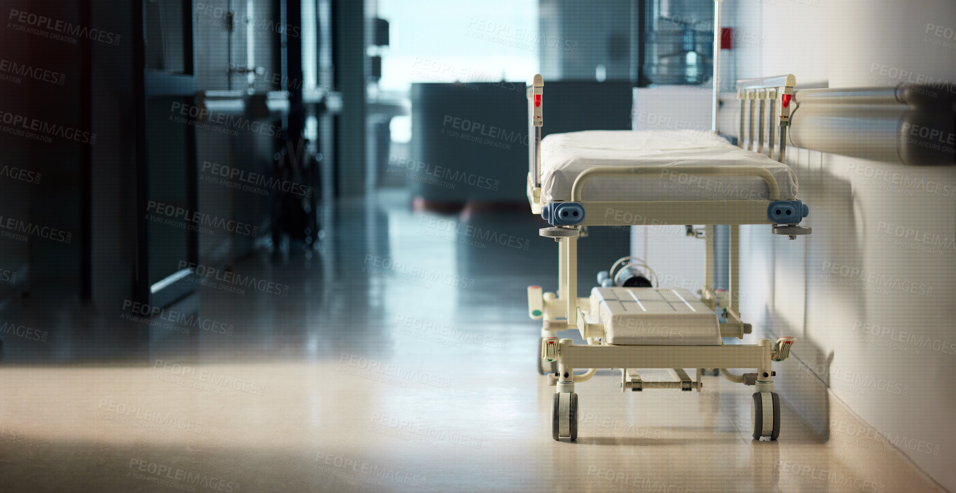 Buy stock photo Healthcare, medicine and a bed in the corridor of a hospital after work, ready for an emergency or accident. Medical, wellness and service with a gurney in the empty hallway of a health clinic