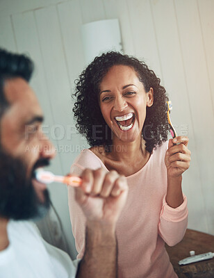 Buy stock photo Cleaning, teeth and couple in bathroom with dental, healthcare and wellness in home. Happy, smile and people washing mouth with toothbrush, toothpaste and healthy brushing together in morning routine