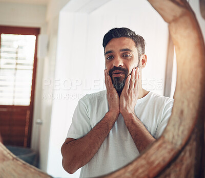 Buy stock photo Mature man, mirror and reflection in home with thinking, wellness and beard for skincare, ideas and morning. Person, bathroom and check face for beauty, health and facial hair with routine in house