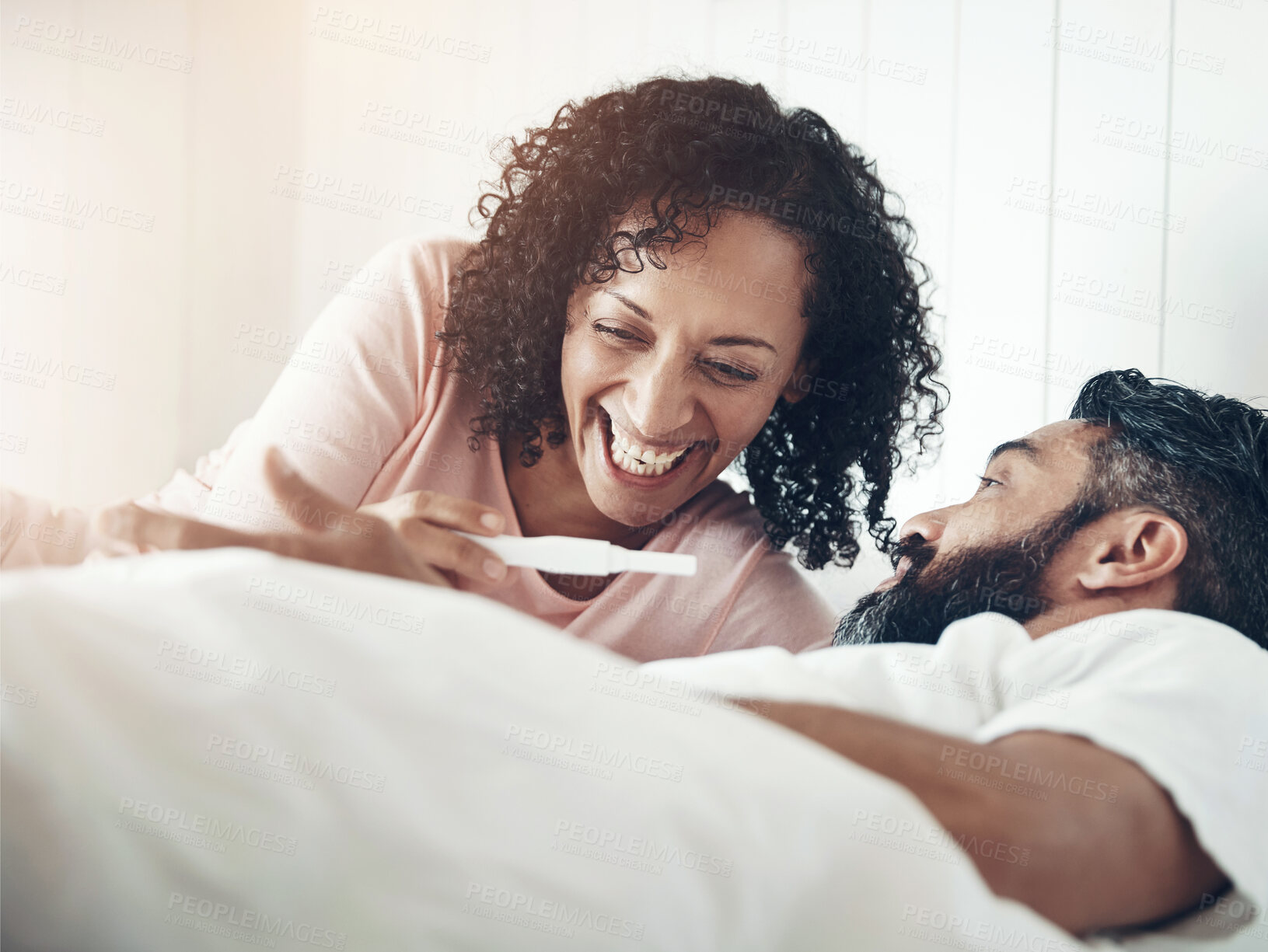 Buy stock photo Mature couple, pregnancy test and happy for results, bed or home for celebration, surprise and announcement. Woman, man and excited smile for ivf success, pregnant partner or hope for baby in morning