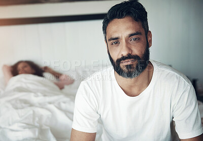 Buy stock photo Sad, depression and portrait of a man on a bed with wife sleeping in the morning. Upset, depressed and a mature male person looking tired, frustrated or unhappy with a woman in the bedroom for sleep