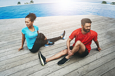 Buy stock photo Stretching, legs and couple in exercise on deck to start fitness, training or outdoor with pool. Runner, workout and people together in preparation for sports, performance and warm up for back