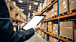 Worker with tablet in shipping warehouse. Product distribution and logistics