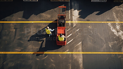 Top-down view: Workers with forklift ready to move boxes in distribution center.